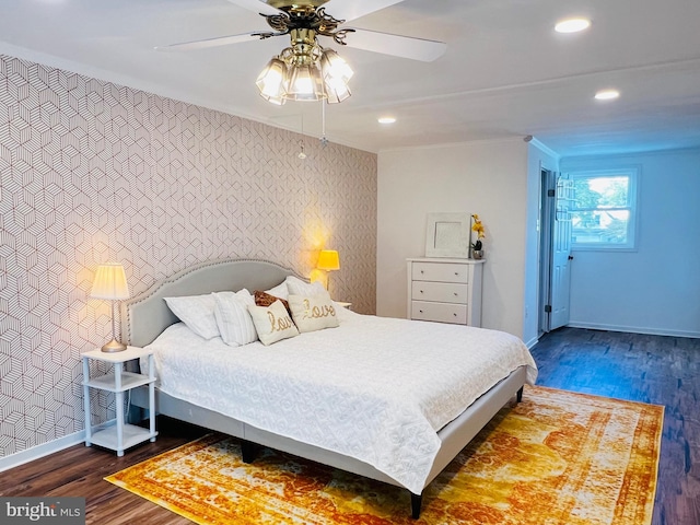 bedroom featuring ceiling fan and dark hardwood / wood-style flooring