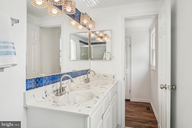 bathroom featuring hardwood / wood-style flooring and vanity