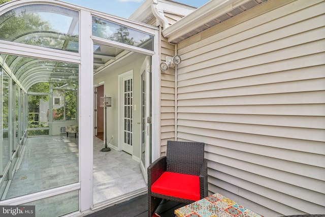 view of exterior entry featuring french doors