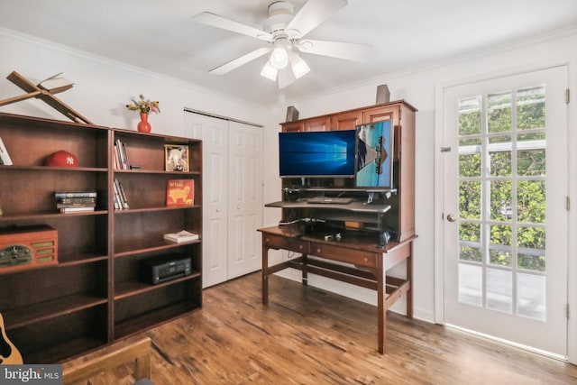 office space featuring crown molding, ceiling fan, and hardwood / wood-style flooring