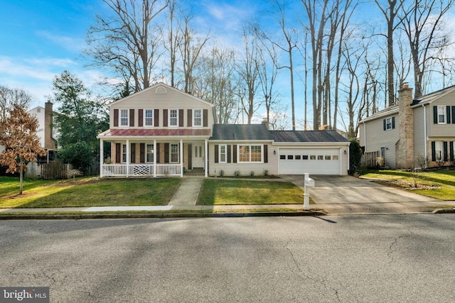 view of front of house with a porch, an attached garage, fence, driveway, and a front lawn