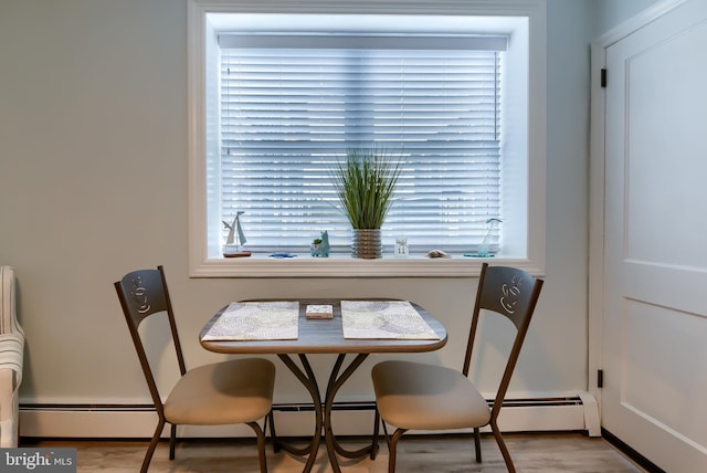 dining space with light hardwood / wood-style flooring