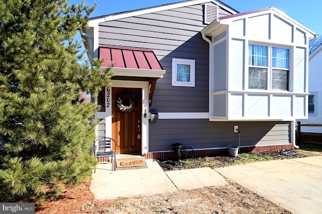 view of front of property with metal roof and a standing seam roof