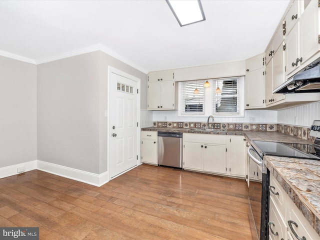 kitchen with white cabinetry, sink, stainless steel appliances, and light hardwood / wood-style floors