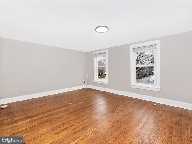 spare room with wood-type flooring