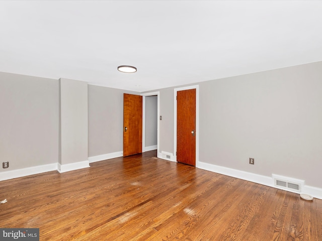 empty room featuring hardwood / wood-style floors