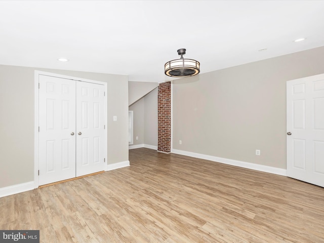 unfurnished living room featuring light hardwood / wood-style flooring