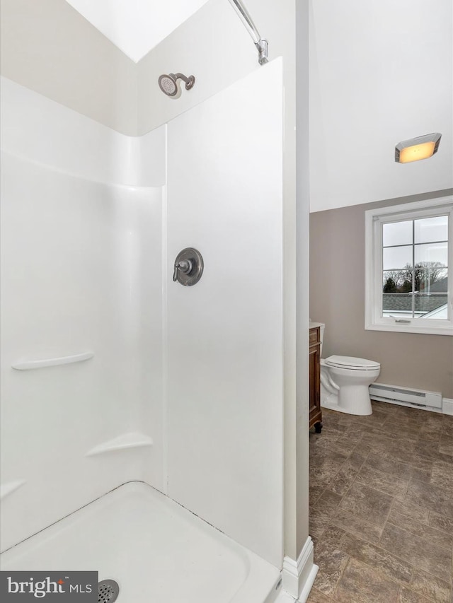 bathroom featuring walk in shower, a baseboard radiator, vanity, and toilet