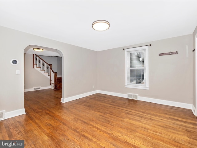 spare room with hardwood / wood-style floors