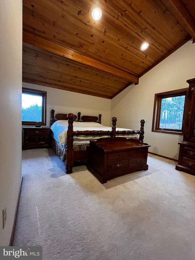 carpeted bedroom with vaulted ceiling with beams and wood ceiling