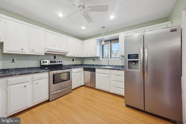 kitchen with white cabinetry, sink, light hardwood / wood-style flooring, and stainless steel appliances