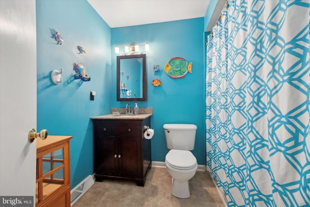 bathroom with vanity, a shower with shower curtain, and toilet