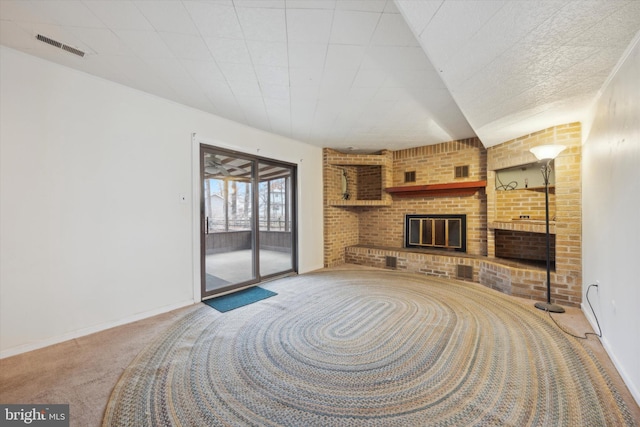 living room with carpet flooring and a fireplace