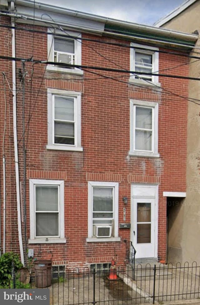 view of side of property featuring cooling unit