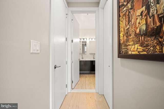 hallway featuring light wood-style flooring