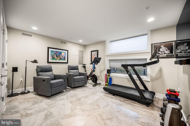 exercise room featuring baseboards, visible vents, and recessed lighting