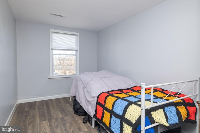 bedroom featuring dark wood-type flooring