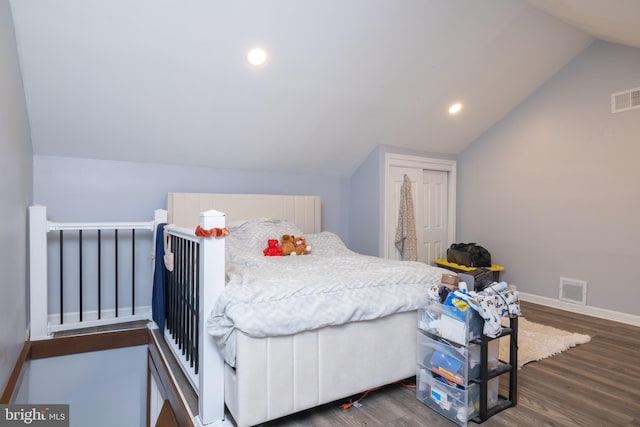 bedroom with dark wood-type flooring and vaulted ceiling