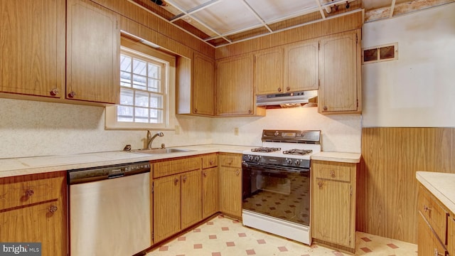 kitchen featuring white gas range, sink, and dishwasher