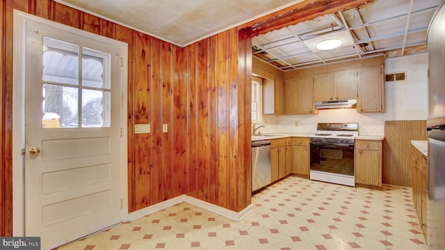 kitchen with white gas range, wooden walls, sink, and dishwasher