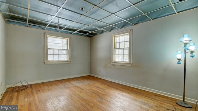 spare room with hardwood / wood-style floors