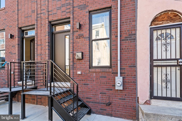 property entrance with brick siding