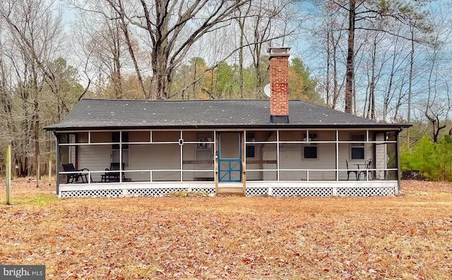 back of property featuring a sunroom