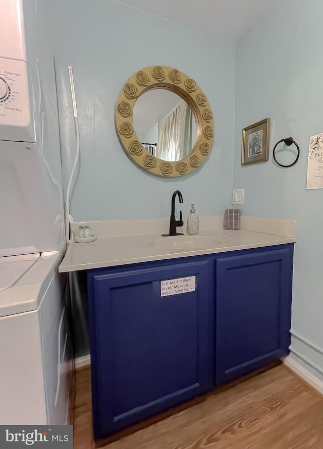 bathroom with vanity and wood-type flooring