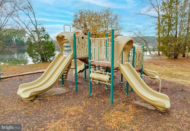 view of playground with a water view