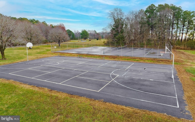 view of basketball court featuring a yard and tennis court