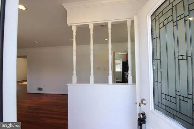 entryway featuring ornamental molding, wood finished floors, visible vents, and recessed lighting