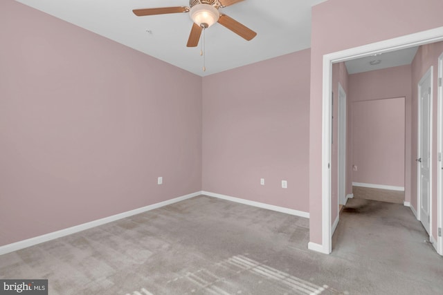 unfurnished bedroom featuring carpet floors, ceiling fan, and baseboards