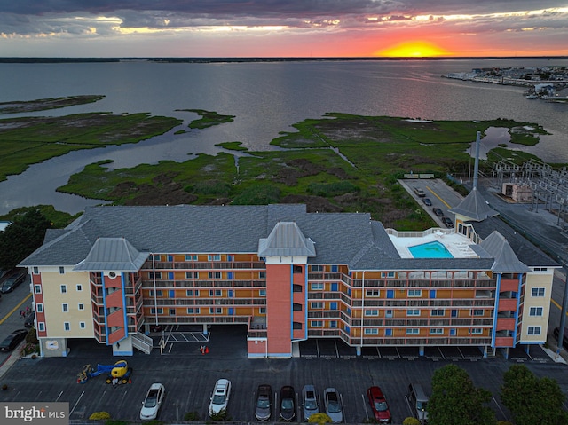 aerial view at dusk with a water view