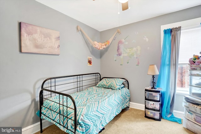 carpeted bedroom featuring ceiling fan