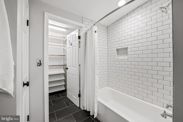 bathroom featuring shower / bath combo and tile patterned flooring