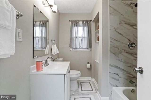 full bathroom featuring plenty of natural light, toilet, tiled shower / bath combo, and vanity