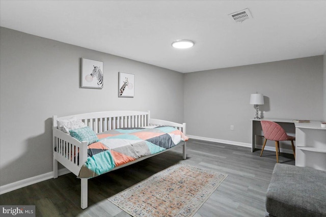 bedroom featuring hardwood / wood-style flooring