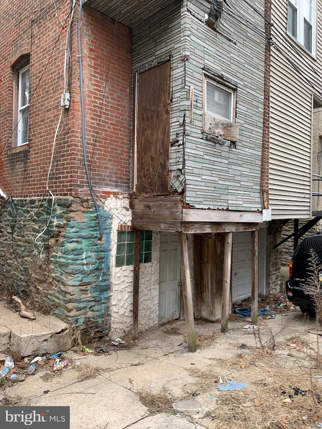 view of side of home featuring a garage