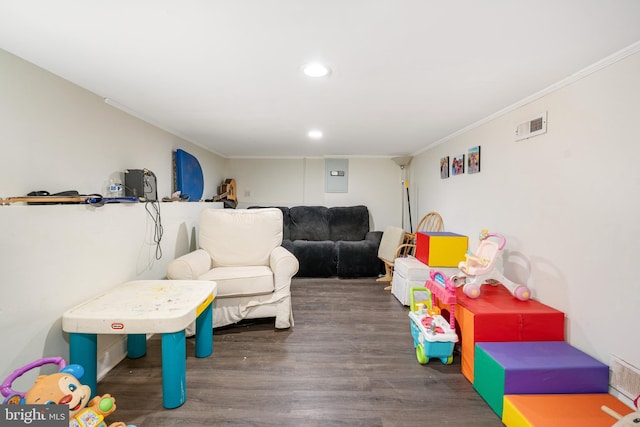 game room with crown molding and dark hardwood / wood-style floors