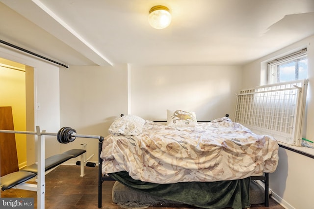 bedroom featuring dark wood-type flooring