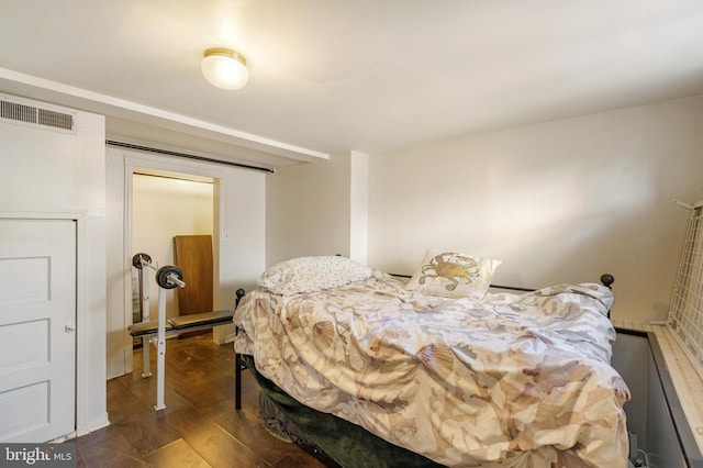 bedroom featuring dark wood-type flooring