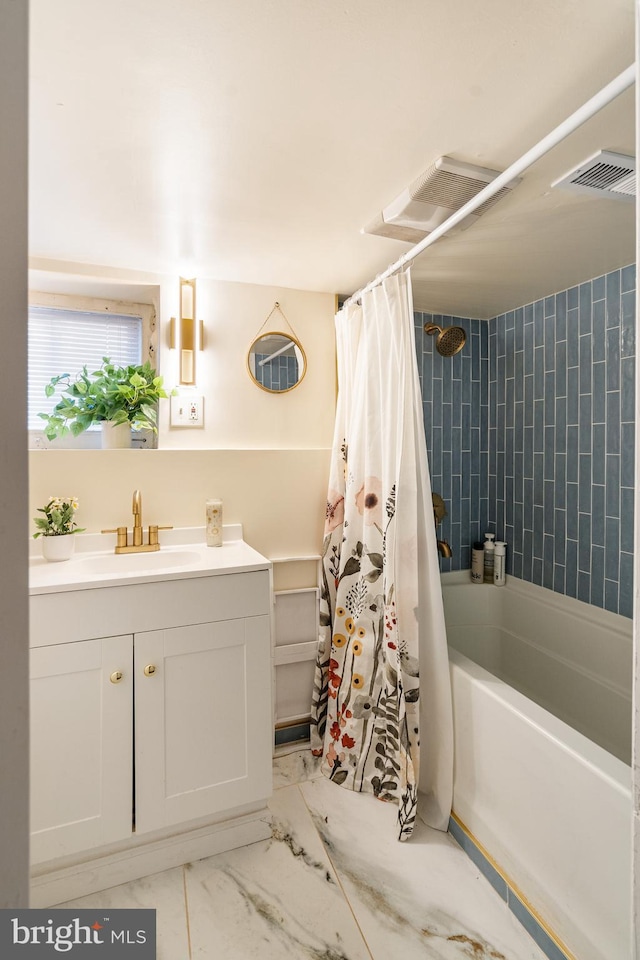 bathroom featuring vanity and shower / tub combo