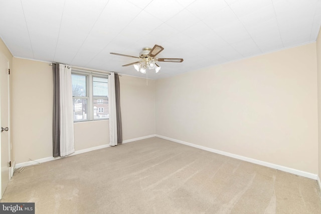 unfurnished room featuring ceiling fan and light carpet