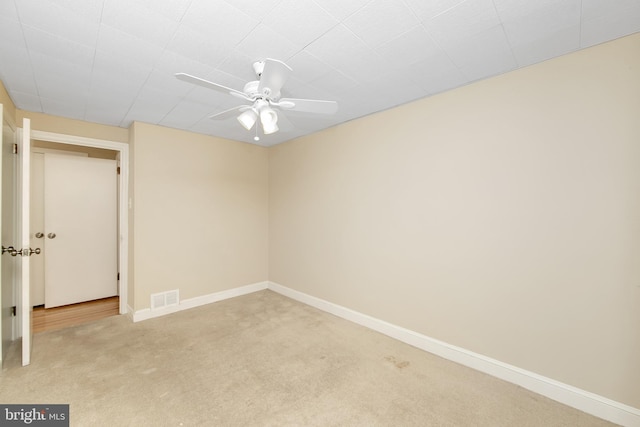 unfurnished room featuring carpet flooring and ceiling fan