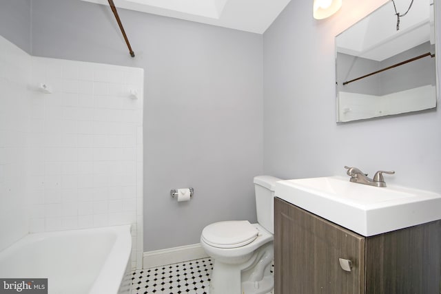 full bathroom featuring toilet, vanity, tile patterned flooring, and tiled shower / bath