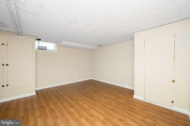 basement featuring hardwood / wood-style floors