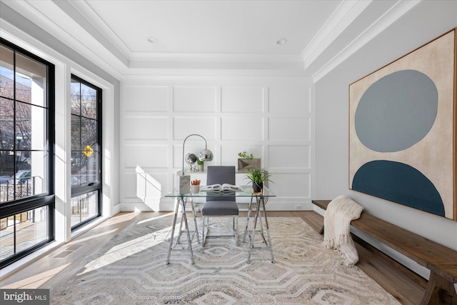 office featuring ornamental molding and light hardwood / wood-style flooring