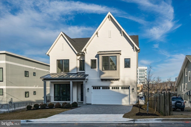 view of front of home featuring a garage and covered porch