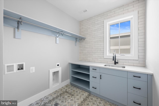 laundry area with washer hookup, hookup for an electric dryer, and sink