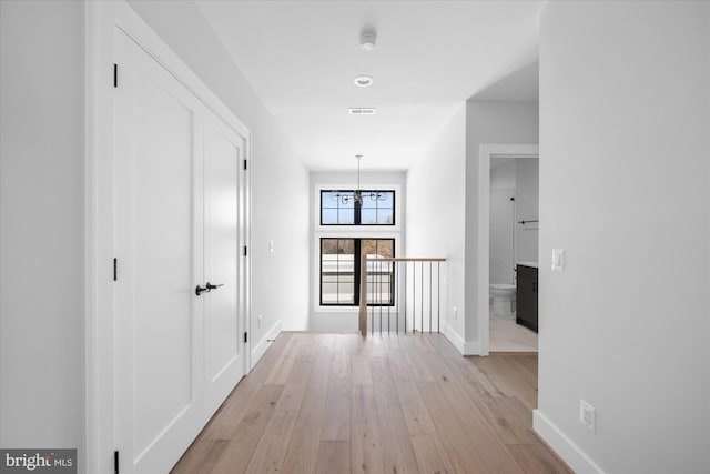 hallway with light wood-type flooring